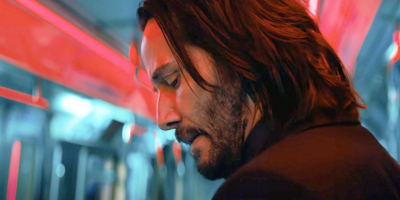 "John Wick: Keanu Reeves em pose icônica com armas da franquia de ação"
